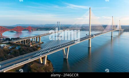 Aerial view of three major bridges crossing River Forth at North Queensferry, closest is Queensferry Crossing Bridge, Scotland UK