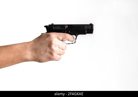 Pistol, or Auto-Loader Short gun in female's hand preparing or self loading prompt to use. Man holding gun aiming pistol in hand ready to shoot. The c Stock Photo