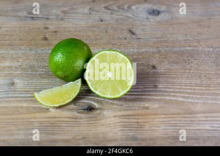 close up of lime on wooden background Stock Photo