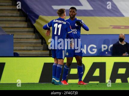 Leicester City's Kelechi Iheanacho (right) celebrates scoring their side's third goal of the game with team-mate Marc Albrighton during the Emirates FA Cup quarter final match at the King Power Stadium, Leicester. Picture date: Sunday March 21, 2021. Stock Photo