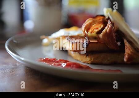 Breakfast french toast with bacon egg and cheese with jam on wood table background Stock Photo