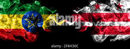 Ethiopia, Ethiopian vs United States of America, America, US, USA, American, District of Columbia, Washington smoky mystic flags placed side by side. Stock Photo