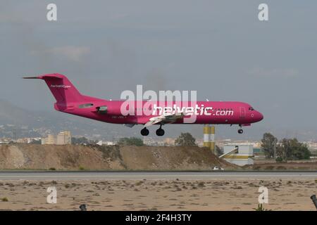 Swiss Helvetic Airways Fokker 100 (HB-JVC) landing at Malaga airport, Spain. Stock Photo