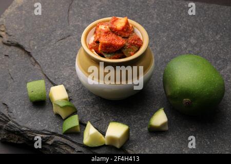 Homemade Mango Pickle or aam ka achar Kairi Loncha with Ingredients. Stock Photo