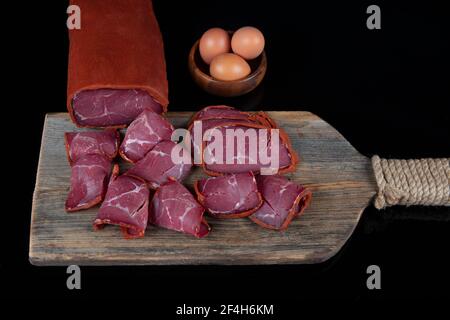 pastrami ( dried meat with spices ). beef bacon sliced. traditional turkish food pastirma. Stock Photo