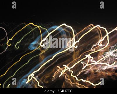 Abstract neon background, movement, multicolored highlights on a black background. High quality photo Stock Photo