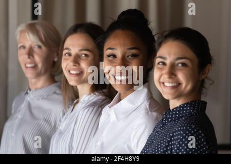 Portrait of smiling multiracial female colleagues posing Stock Photo
