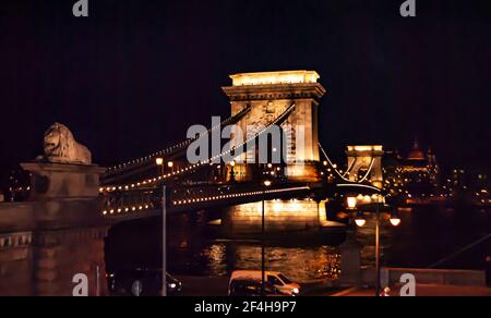 Budapest, Hungary, March 19, 2019: Chain Bridge illuminated at night and many lanterns on it, in Budapest, Hungary Stock Photo