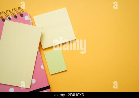 Colorful office supplies on yellow background Stock Photo