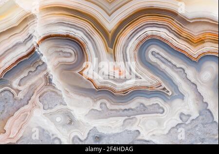 Macro photograph of the banding pattern in a Crazy Lace agate from Mexico Stock Photo