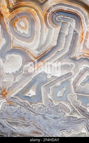 Macro photograph of the banding pattern in a Crazy Lace agate from Mexico Stock Photo