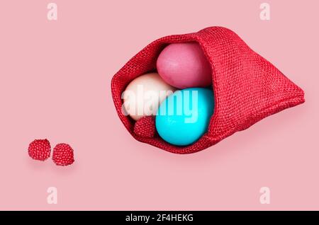 Easter eggs in a bag, on a pink background. Easter Concept Stock Photo