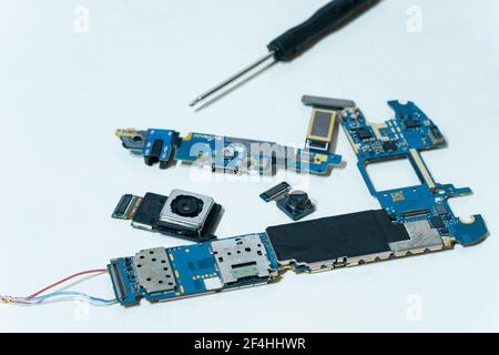 Smartphone component parts,camera chip and printed circuit motherboard,tech Stock Photo