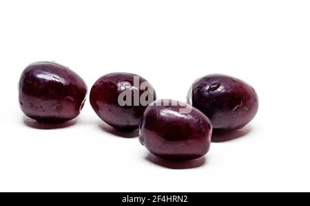 many red grapes on white background Stock Photo