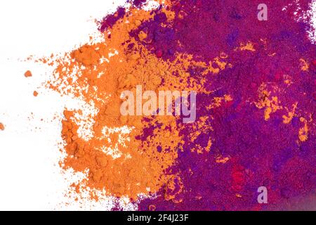 Colored powder explosion. Abstract closeup dust on backdrops. Stock Photo