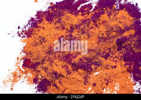 Multi-colored abstract powder explosion on white backgrounds. Stock Photo