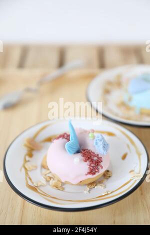 Fancy donut with cute mermaid on top Stock Photo