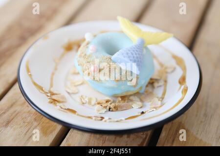Fancy donut with cute mermaid on top Stock Photo
