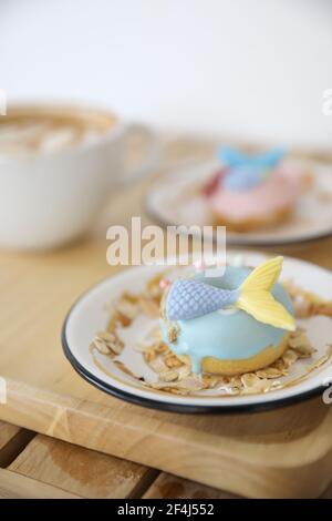 Fancy donut with cute mermaid on top Stock Photo