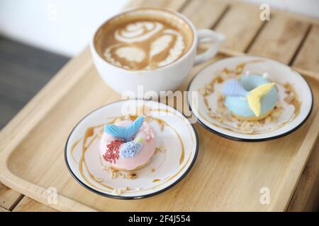 Fancy donut with cute mermaid on top Stock Photo
