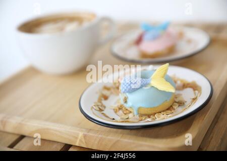 Fancy donut with cute mermaid on top Stock Photo