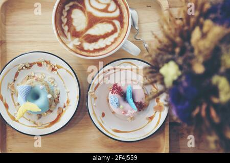 Fancy donut with cute mermaid on top Stock Photo