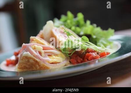 Breakfast burrito ham and eggs with salad vintage style Stock Photo