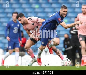 London, UK. 21st Mar, 2021. Chelsea's Mateo Kovacic (R) vies with Sheffield United's George Baldock during the FA Cup quarterfinal match between Chelsea and Sheffield United at Stamford Bridge in London, Britain on March 21, 2021. Credit: Matthew Impey/Xinhua/Alamy Live News Stock Photo