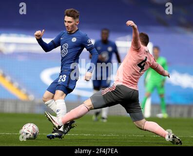 London, UK. 21st Mar, 2021. Chelsea's Billy Gilmour (L) vies with Sheffield United's John Fleck during the FA Cup quarterfinal match between Chelsea and Sheffield United at Stamford Bridge in London, Britain on March 21, 2021. Credit: Matthew Impey/Xinhua/Alamy Live News Stock Photo