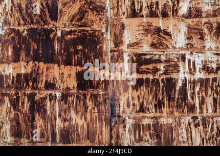 rusty metal background, old garage door. scuffs and scratches red background. Stock Photo