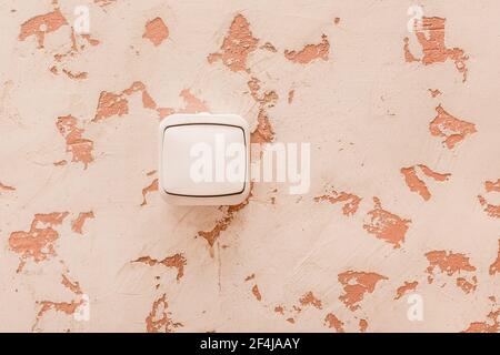 Electric switch on the wall in a modern room interior background. Stock Photo