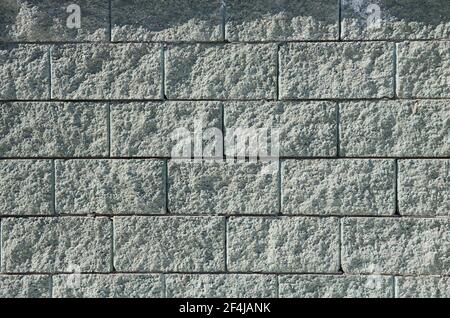 gray brick wall texture parallel and perpendicular joints Stock Photo