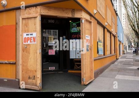 Bangkok Palace, a Thai restaurant in downtown Portland, is seen open for business on Sunday, March 21, 2021, while still being boarded up amid riots... Stock Photo