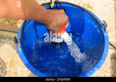Testing bilge pump connected to use power from solar cell panel Stock Photo