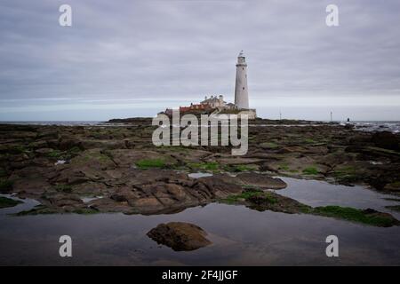 St Mary's Lighthouse stands on St Mary's Island just off the North Sea coast at Whitley Bay in North-East England. Stock Photo