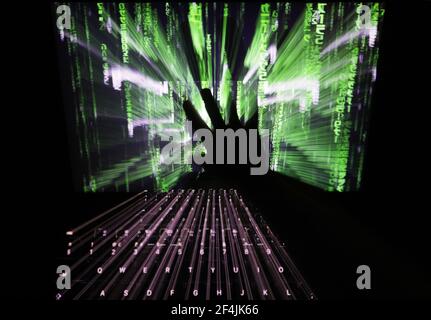 File photo dated 30/11/2016 of a zoom burst photo of a user touching the screen of a laptop. More than 15,000 reports of email and social media hacking were received by Action Fraud in the last year. Issue date: Monday March 22, 2021. Stock Photo