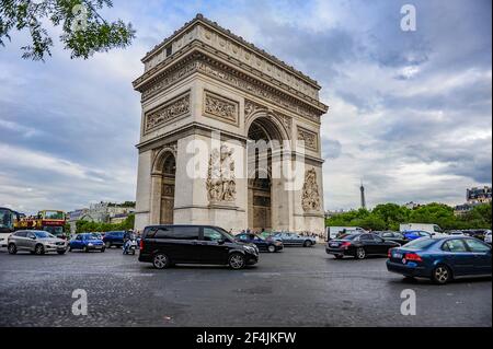 Paris, France - July 18, 2019: Busy traffic around the Triumphal Arch of Paris, France