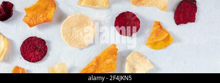 Fruit and vegetable chips panorama with copy space, overhead shot Stock Photo