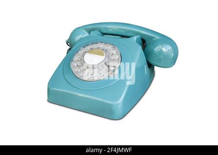 Turquoise rotary dial seventies telephone. Isolated over white Stock Photo