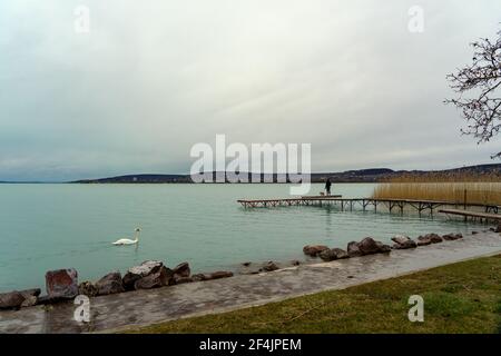 Wooden pier on the Lake Balaton in Balatonfuzfo Hungary . Stock Photo