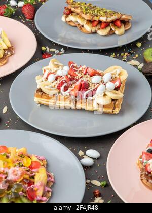 Three different waffles in square, heart and bubble shape. Stock Photo