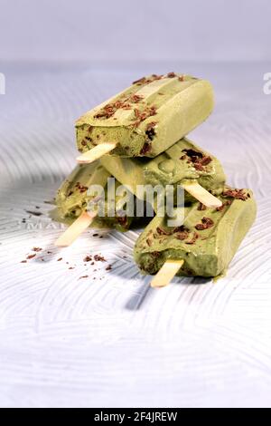 Macha popsicle on a white surface Stock Photo