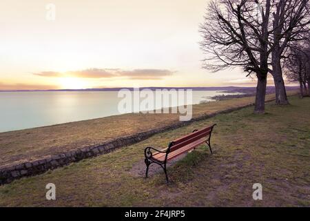 sunset over lake Balaton from Balatonakarattya high part with a bench . Stock Photo