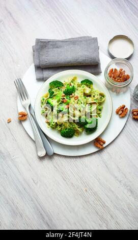 Italian fettuccine with broccoli pesto and walnuts Stock Photo