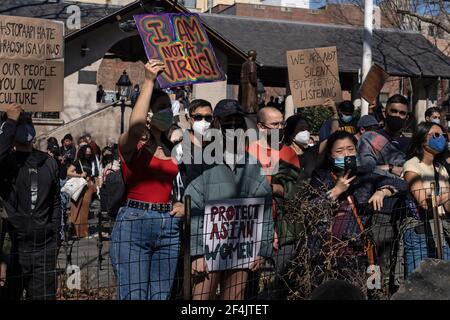 NEW YORK, NY - MARCH 21: People hold up signs at a rally against hate in Columbus Park in the Chinatown neighborhood of Manhattan on March 21, 2021 in New York City. A rally for solidarity was organized in response to a rise in hate crimes against the Asian community since the start of the coronavirus (COVID-19) pandemic in 2020. On March 16 in Atlanta, Georgia, a man went on a shooting spree in three spas that left eight people dead, including six Asian women.Protesters hold placards during a rally against hate in Columbus Park in the Chinatown neighbourhood of Manhattan in New York City. A r Stock Photo