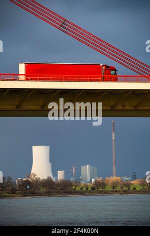 Beeckerwerther Bridge, motorway bridge, A42, truck, cargo ship on the Rhine, behind the STEAG coal-fired power plant Duisburg-Walsum, cooling tower, i Stock Photo