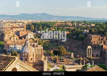 Rome historic architecture, view to Roman Forum and Coliseum from rooftop of monument to Vittorio Emanuele II. Stock Photo