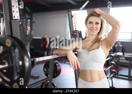 Young woman athlete stands in the gym Stock Photo
