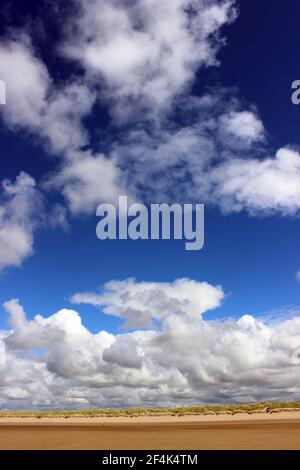 Billowing Cumulus Clouds Above The Sand Dunes Of Formby Beach, Sefton Coast UK Stock Photo