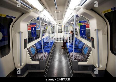 File photo dated 12/01/21 of a commuter travelling on the Jubilee Line underground train during the morning rush hour in London, as England's third national lockdown to curb the spread of coronavirus continued. Tuesday marks the first anniversary of the announcement on March 23, 2020 of the first UK-wide lockdown. Issue date: Monday March 22, 2021. Stock Photo